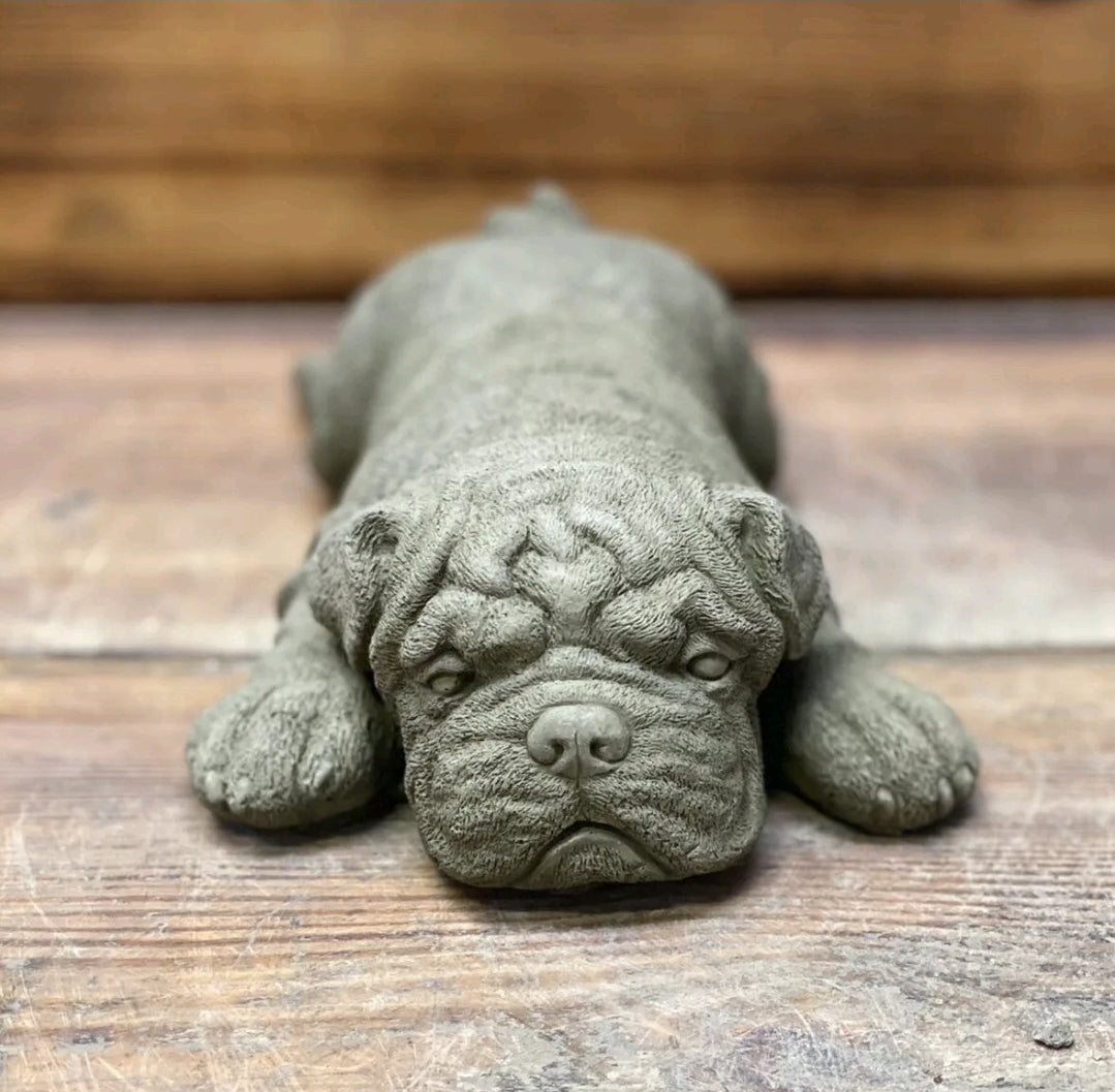 Laying sleeping bulldog statue